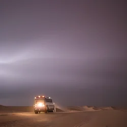 AI image generated from prompt: "a cinematic wide shot of a desert caravan crossing dunes under a vast storm sky, epic scale" — Cinematic, ChilloutMix model
